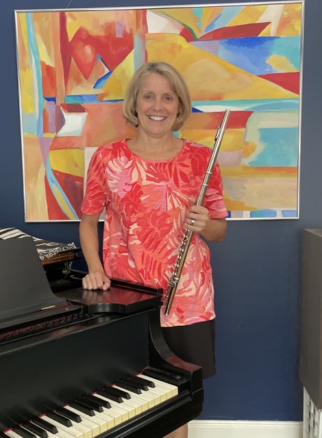 Anne Dyke with her flute and piano